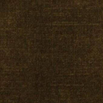 Dark brown woven fabric texture with subtle horizontal grain, mottled tone, and scattered light flecks, presented on a neutral background.